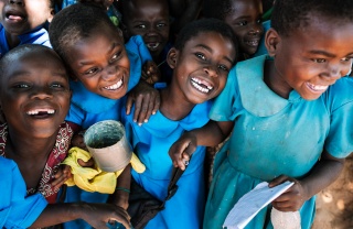 Children in Malawi eating Mary's Meals